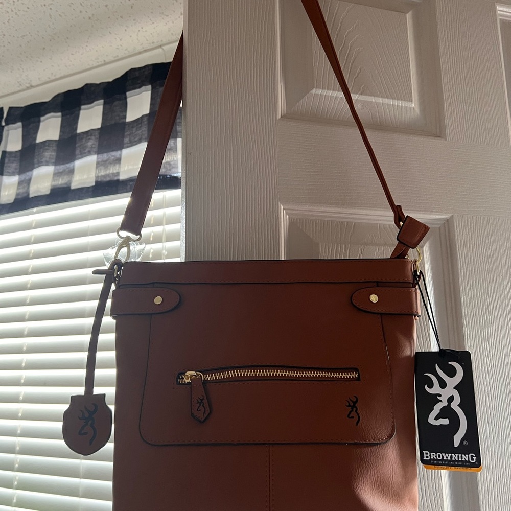 Browning purse with gun holster. Never been used.